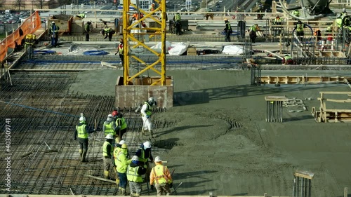 Timelapse video of Pouring concrete floors of highrise Construction. 