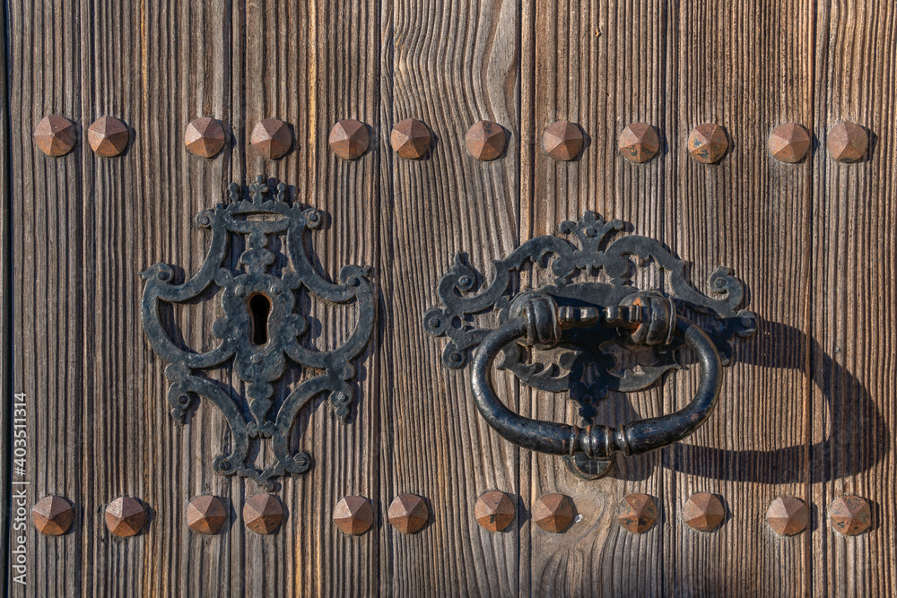 Detail of an antique door handle made of iron Detail of an antique door handle made of iron