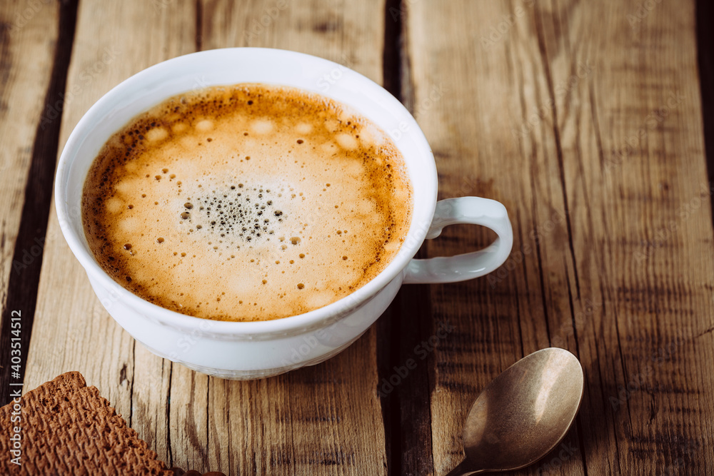 Delicious cappuccino on wooden table Delicious cappuccino on wooden table