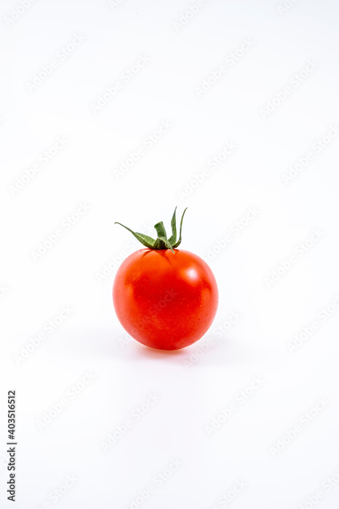 lonely cherry tomato on white background lonely cherry tomato on white background