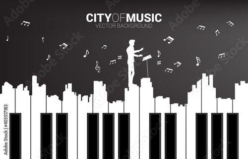 Vector silhouette of conductor with piano key shaped the the big city outline silhouette. Background concept for classic song event and music festival