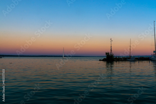 Harbour of sailboats in Balatonkenese at sunset