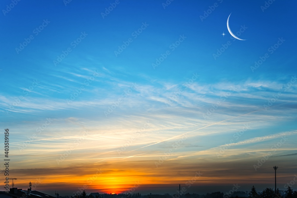 Crescent moon with beautiful sunset background . Generous Ramadan . Religion background