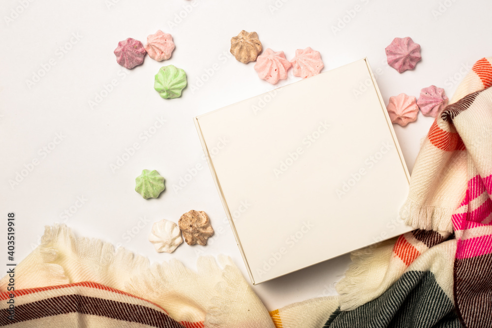 Composition of Valentine's Day. Gift and sweets on a white background with flowers. Banner. Flat lay, top view