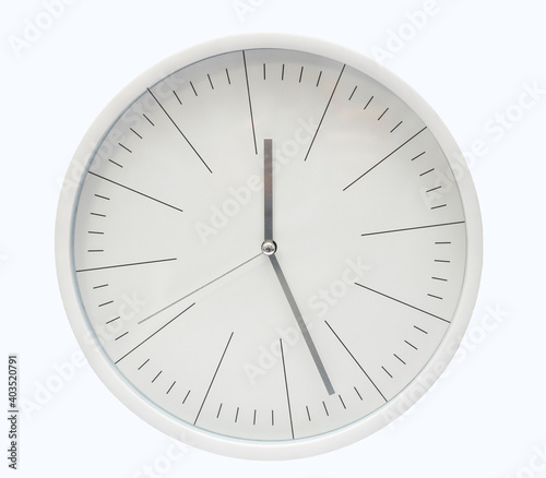 Modern, round, white clock isolated on a white background.