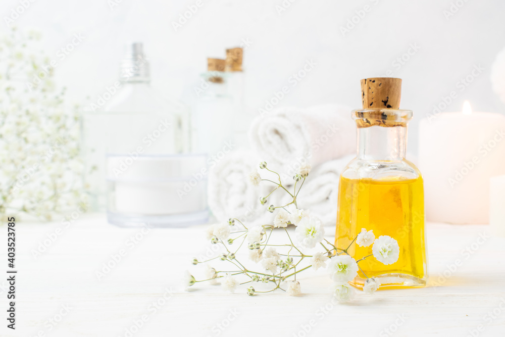 A jar of essential oil on a wooden table. Spa treatments. Massage. Cosmetics. A jar of essential oil on a wooden table. Spa treatments. Massage. Cosmetics.