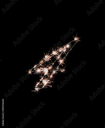 the digit 4 made from sparks of Bengal lights isolated on a black background.