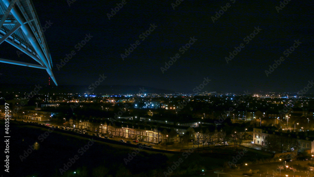 view of the city at night from the top of a hotel.