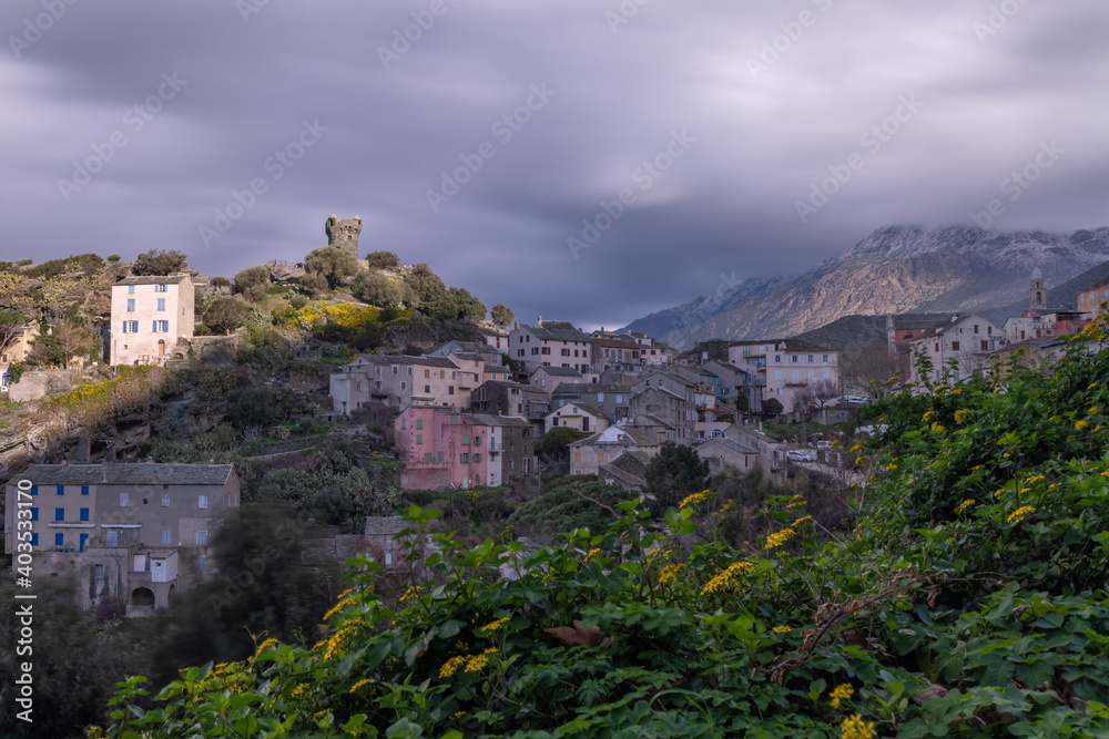 The small village of Nonza in winter, on a cloudy day. Corsica