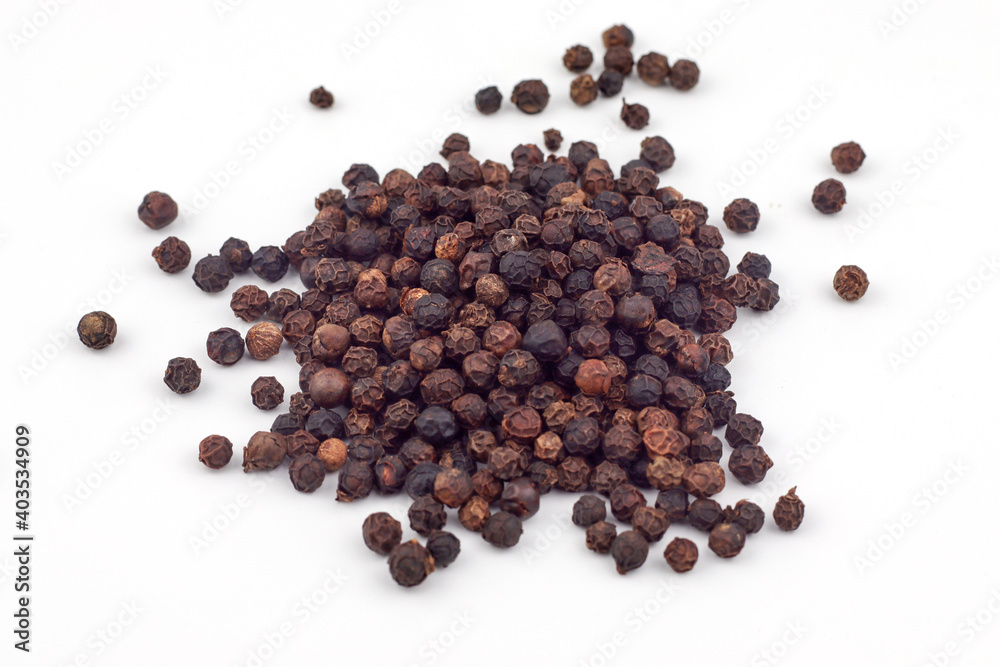 Black pepper on a white background Black pepper on a white background