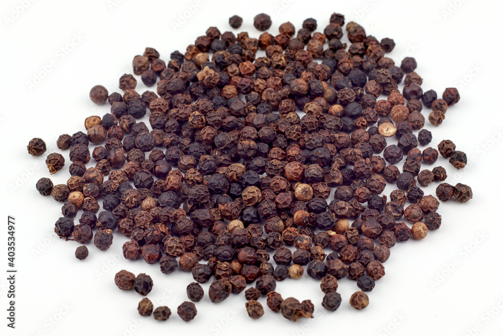 Black pepper on a white background Black pepper on a white background