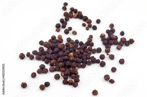 Black pepper on a white background