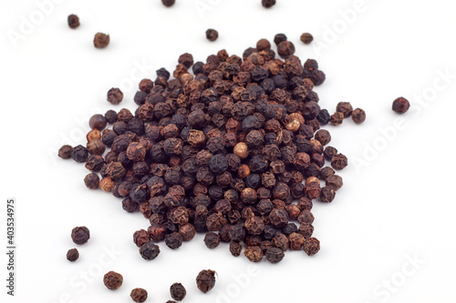 Black pepper on a white background