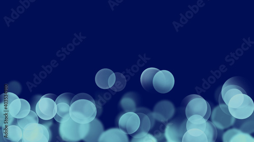 水色の玉ぼけと抽象的な暗い青色の背景イメージ