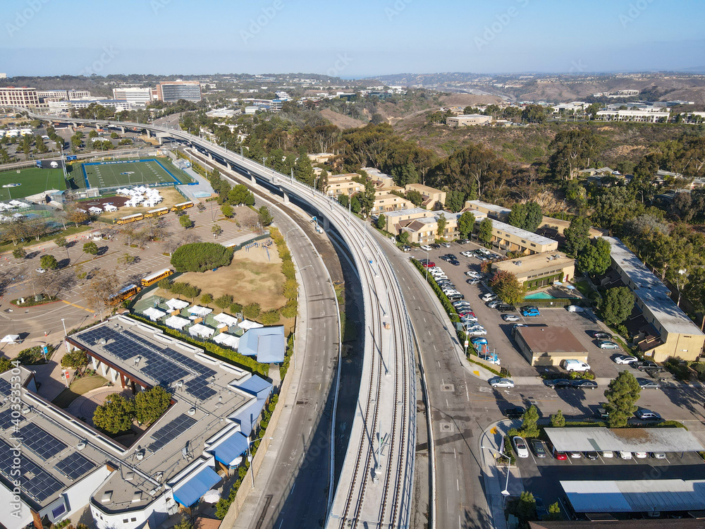 Fototapeta Aerial view of Mid-Coast Trolley bridge in University of California, San Diego, California, USA.