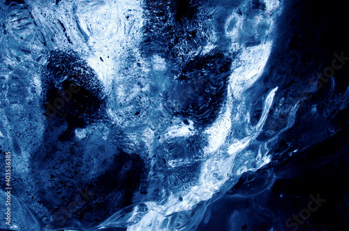 Close up of blue glaicer ice, in Icelandic ice cave during winter.