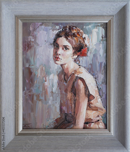 Framed oil painting. Portrait of a girl. The art is done in a realistic manner.