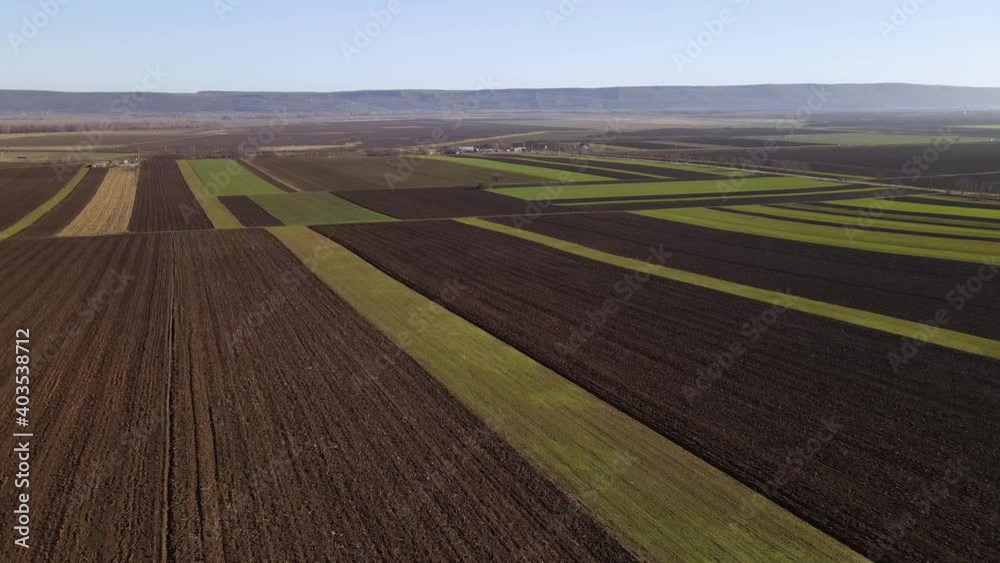Aerial View Of Vast Agricultural Fields In Vrancea County, Romania - drone shot Aerial View Of Vast Agricultural Fields In Vrancea County, Romania - drone shot