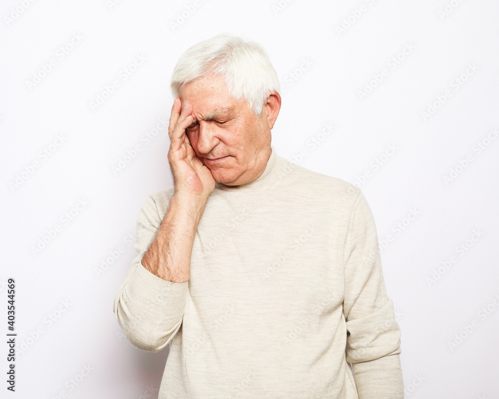 lifestyle, health and old people concept: Senior man wearing casual has headache lifestyle, health and old people concept: Senior man wearing casual has headache