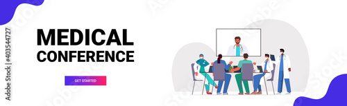 team of doctors having video conference mix race medical specialists discussing at round table medicine healthcare concept horizontal full length copy space vector illustration