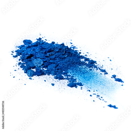 Heap of blue eye shadows isolated on a white background. Trendy make-up concept.