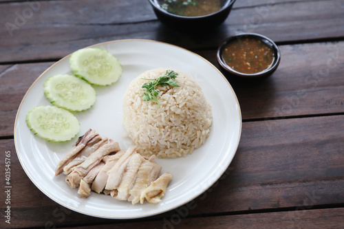 Thai food gourmet steamed chicken with rice khao mun kai in wood background