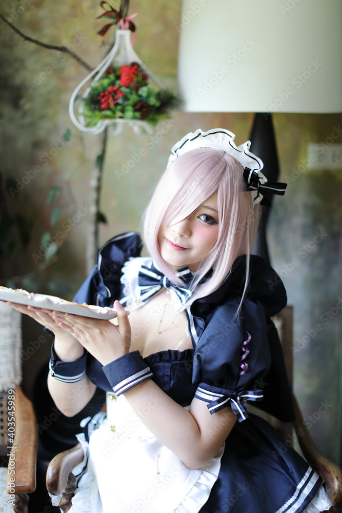 Japan anime cosplay portrait of girl with comic maid costume Japan anime cosplay portrait of girl with comic maid costume