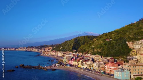 Wallpaper Mural Arial view of Colourful Sicilian Buildings along the coast of Catania.  Smoke can be seen billowing from the recently erupted Mt Etna Torontodigital.ca