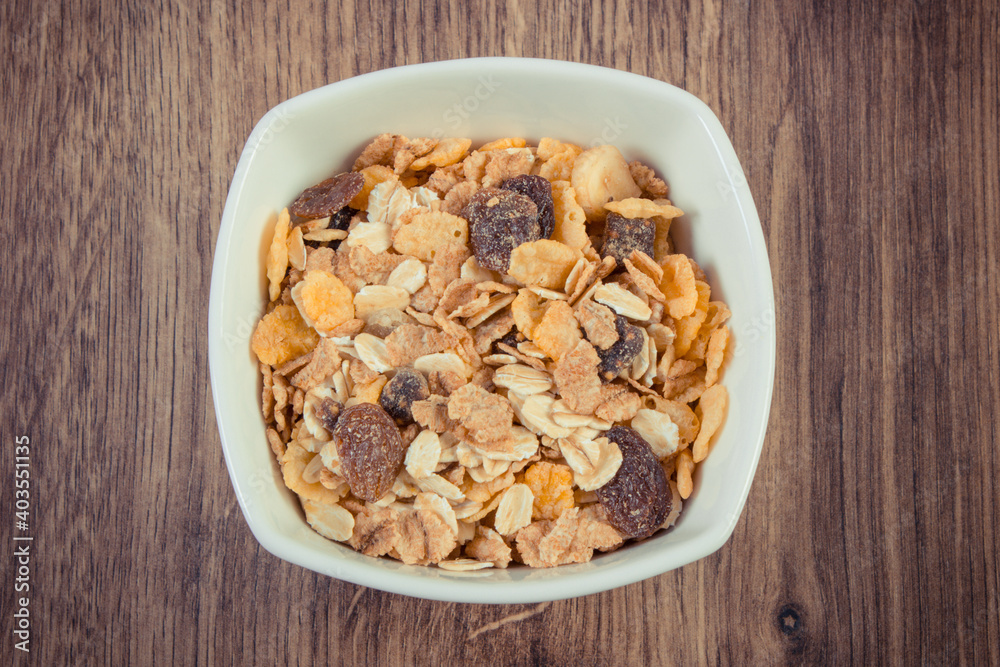 Portion of muesli in glass bowl. Healthy nutrition as source dietary fiber. Increase metabolism Portion of muesli in glass bowl. Healthy nutrition as source dietary fiber. Increase metabolism
