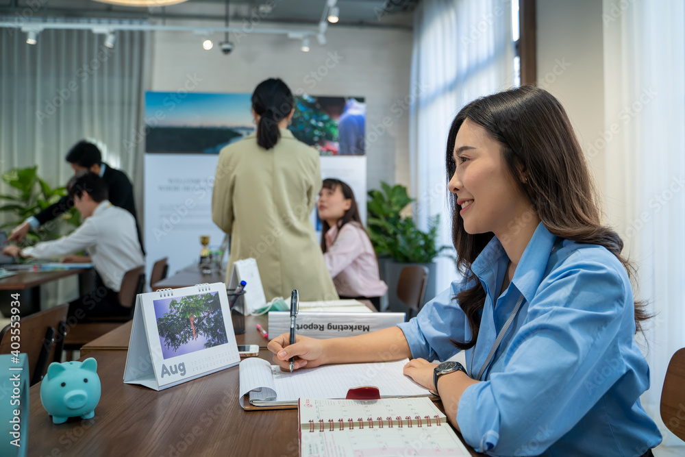 Fototapeta premium Happy smiling Asian business woman working at office.