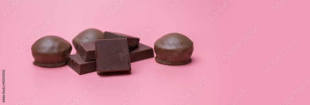 Valentine dark chocolate on pink background, Valentines Day Theme, Banner background Valentine dark chocolate on pink background, Valentines Day Theme, Banner background