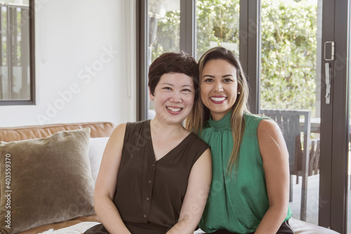 Portrait of happy middle aged Brazilian and Asian women, multiethnic friends at home Free Download Portrait of happy middle aged Brazilian and Asian women, multiethnic friends at home - GFXLoad