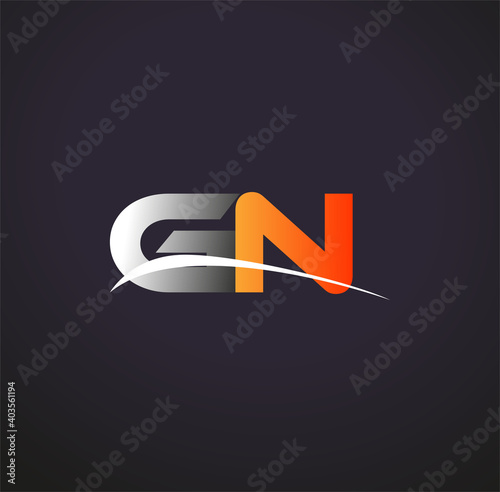 initial letter GN logotype company name colored grey and orange swoosh design. isolated on black background. photo