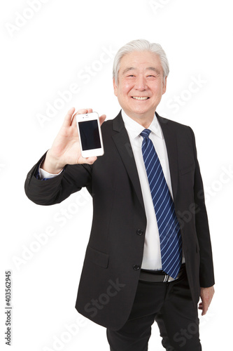 An old senior businessman holding smart phone  © eastfenceimage
