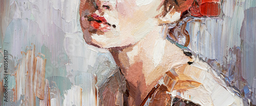 .Fragment of a portrait of a young beautiful girl with red lips. Oil painting on canvas. photo