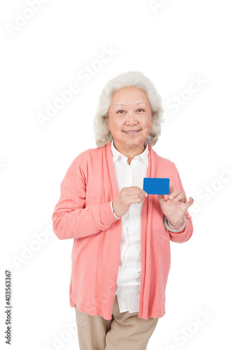 An old senior woman holding name card