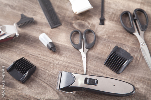 Hair clippers and hair trimmer with comb and scissors.