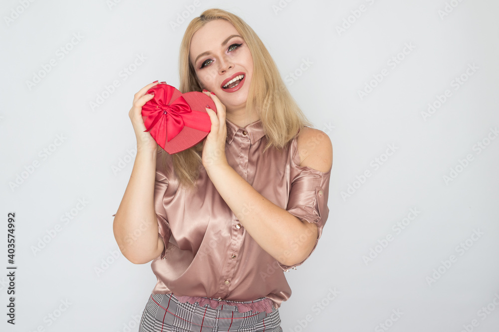dreaming woman in pink blouse holding red gift box heart dreaming woman in pink blouse holding red gift box heart