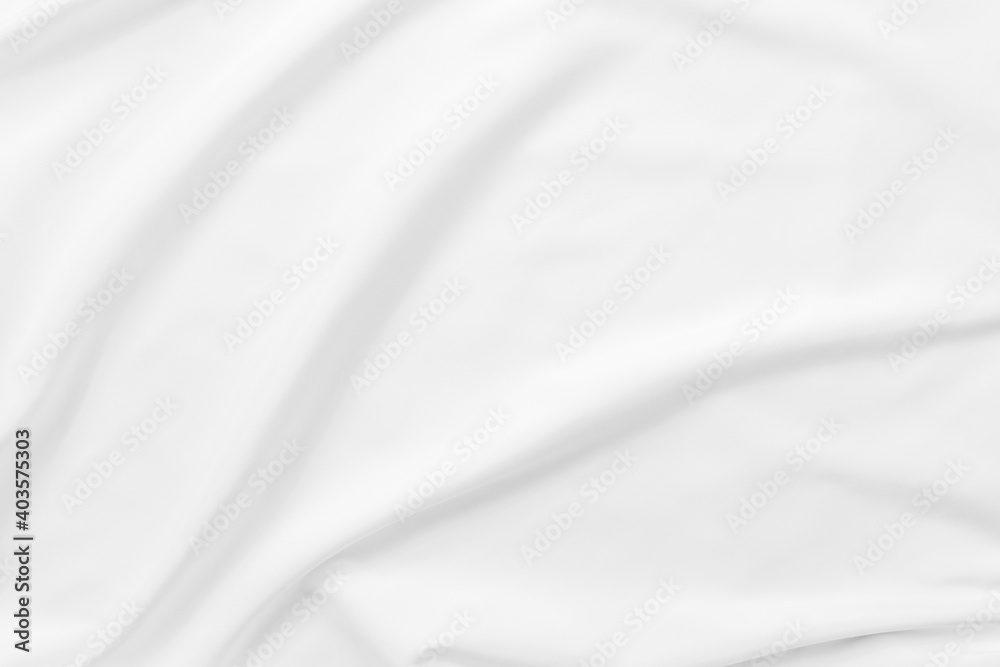 Abstract white fabric texture background. Cloth soft wave. Creases of satin. silk and cotton.