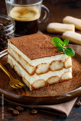 A slice of Italian dessert - tiramisu. Selective focus. Close-up