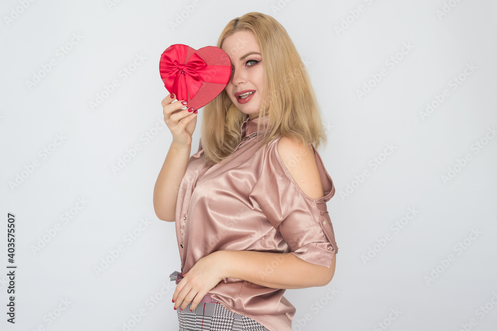dreaming woman in pink blouse holding red gift box heart dreaming woman in pink blouse holding red gift box heart