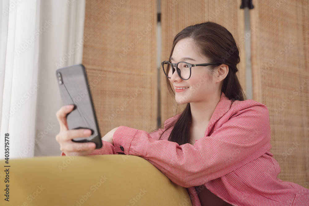 Young asian beauty woman wear eyeglasses vlogging or live stream with smartphone. Young asian beauty woman wear eyeglasses vlogging or live stream with smartphone.