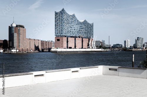 The modern Elbphilarmonie in Hamburg Germany is a tourist site located at the bank of river Elbe. photo