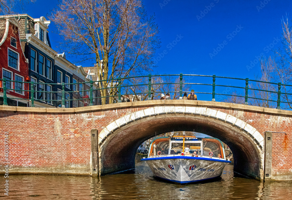 Sightseeing boat in AMsterdam water canals