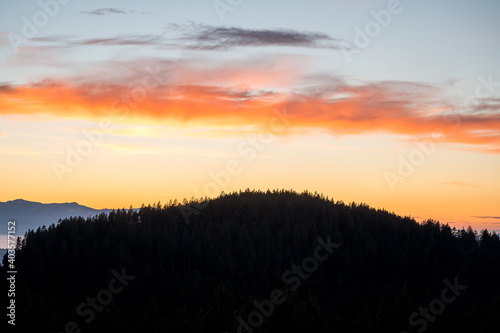 autumn sunset over a forested hill in Emmental