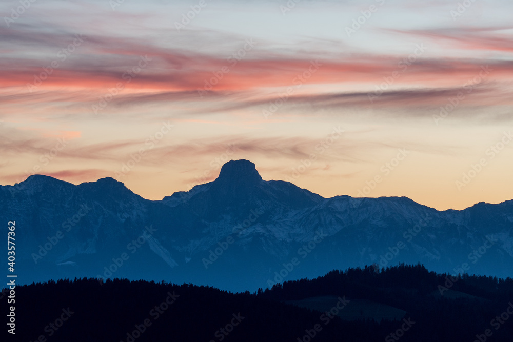 peak of Stockhorn at an autumn sunset  with hills of emmental