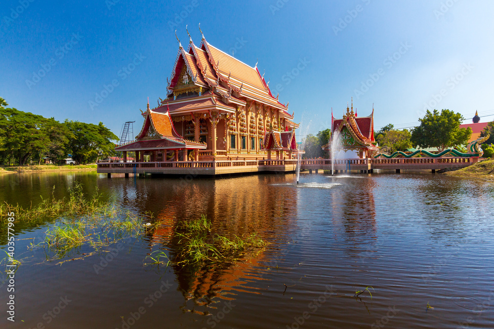 Golden church in the middle of a pond Golden church in the middle of a pond