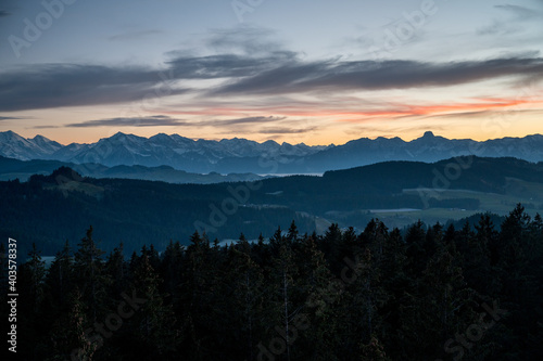 mountain ridge with the peaks of Niesen and Stockhorn at an autumn sunset seen from Chuderh  si