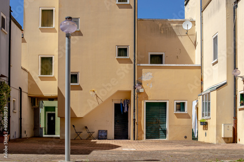 Building yellow facade in a sunny day in Mazzorbo, Venice, Italy