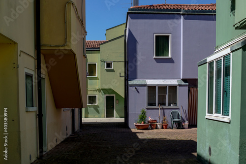 Mazzorbo building colorful facade in a sunny day, Venice, Italy